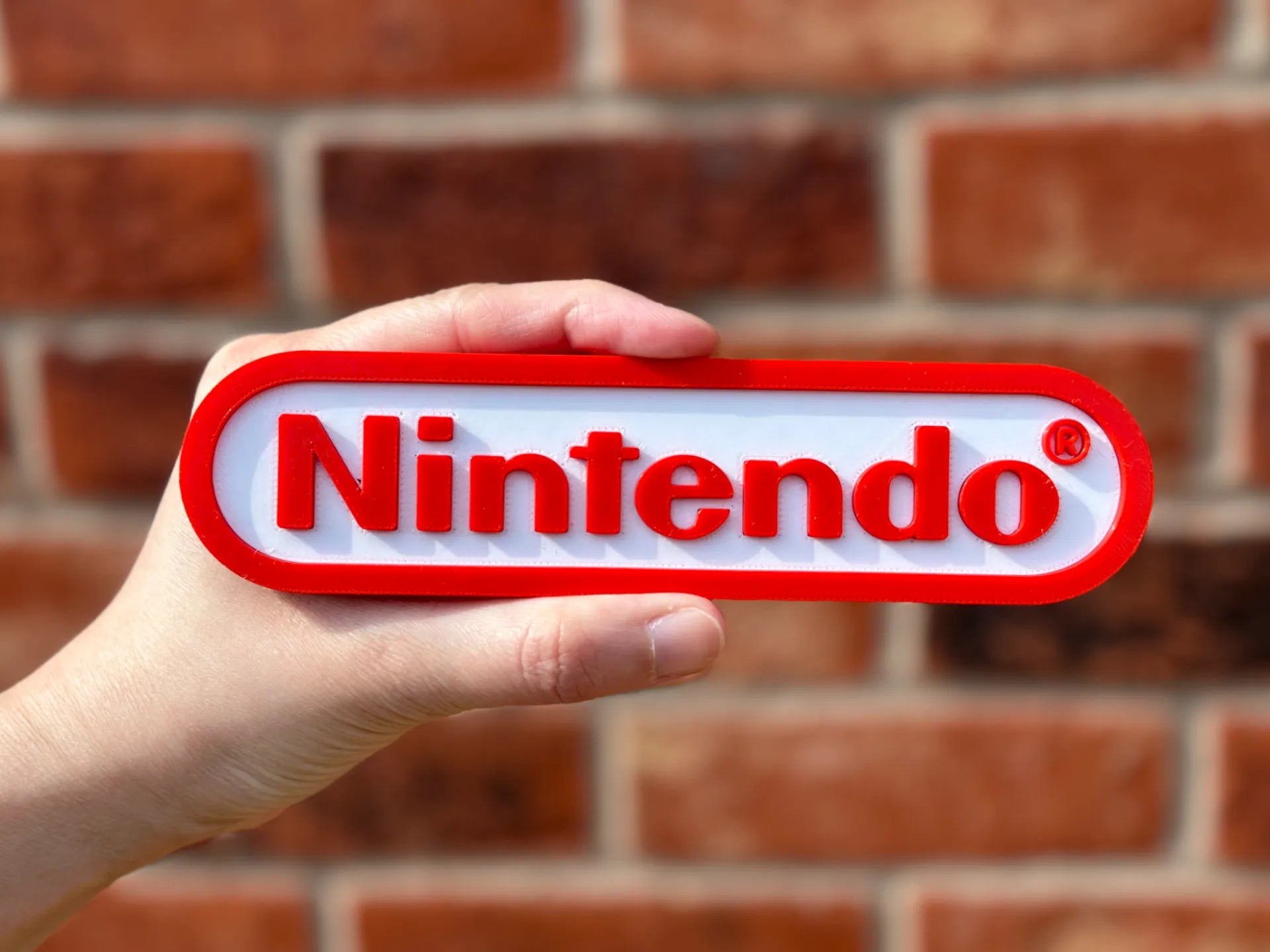 Logo 3D de Nintendo con acabado mate y gran nivel de detalle para decoración de escritorios, vitrinas y espacios gaming.