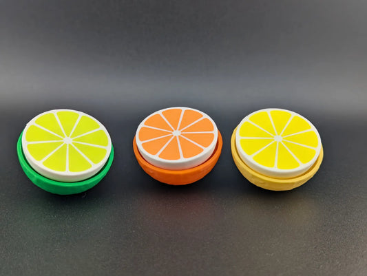 Clicker Cítrico impreso en 3D con diseño de rodaja de cítrico para aliviar el estrés y mantener las manos ocupadas.