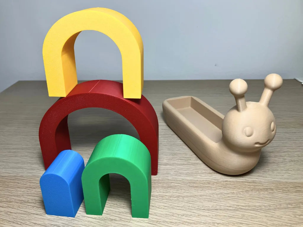 Caracol Apilable Arcoíris, juguete educativo para desarrollar la motricidad fina, la coordinación y la creatividad infantil.