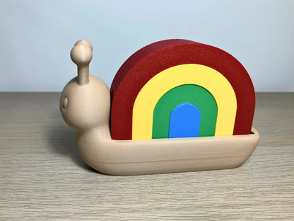 Caracol Apilable Arcoíris, juguete educativo para desarrollar la motricidad fina, la coordinación y la creatividad infantil.