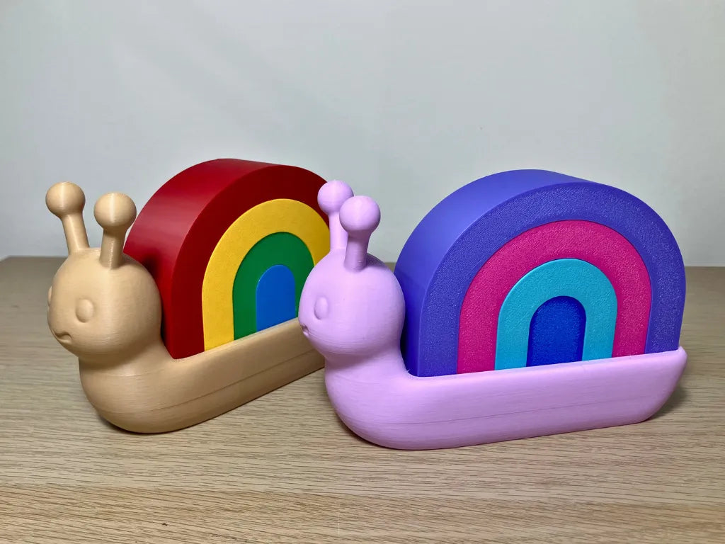 Caracol Apilable Arcoíris, juguete educativo para desarrollar la motricidad fina, la coordinación y la creatividad infantil.