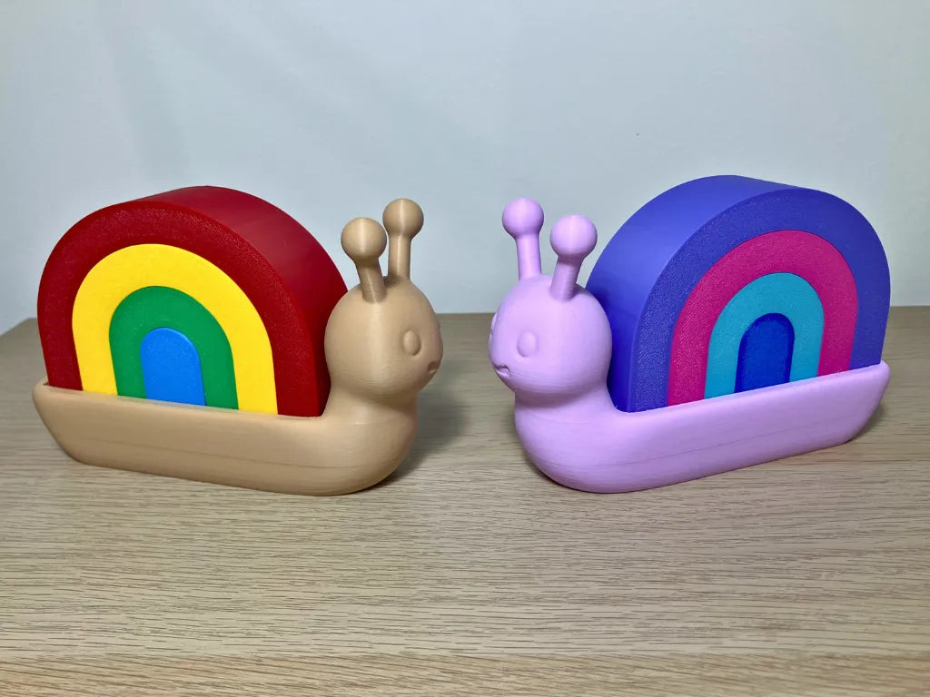 Caracol Apilable Arcoíris, juguete educativo para desarrollar la motricidad fina, la coordinación y la creatividad infantil.