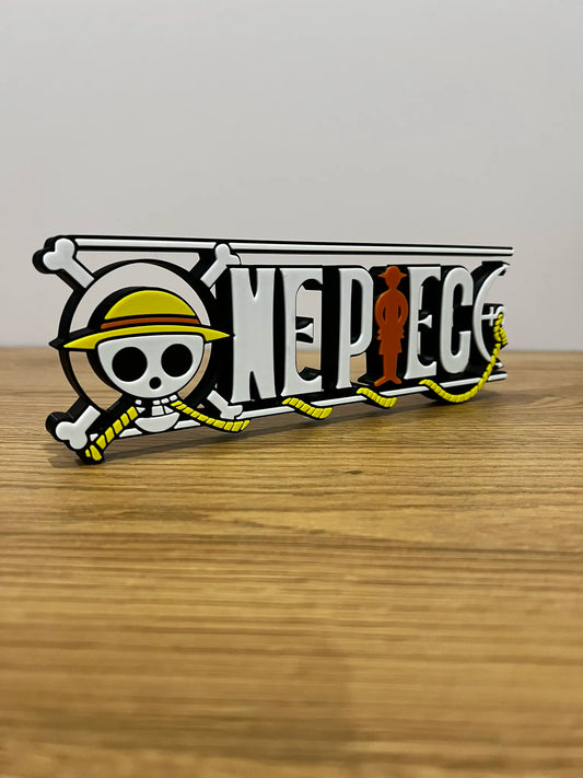 Logo 3D de One Piece con acabado mate y gran nivel de detalle para decoración de escritorios, vitrinas y espacios gaming.