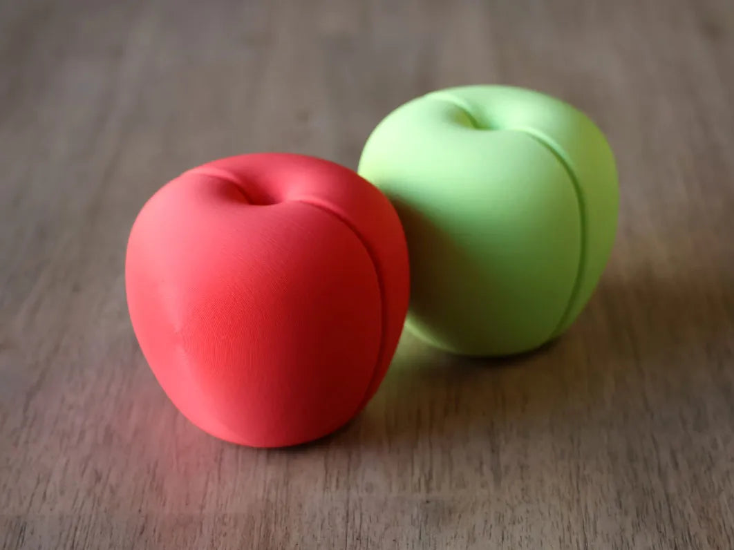 Manzana Magnética Cortable impresa en 3D con piezas magnéticas para cocinitas infantiles y juegos de cocina.